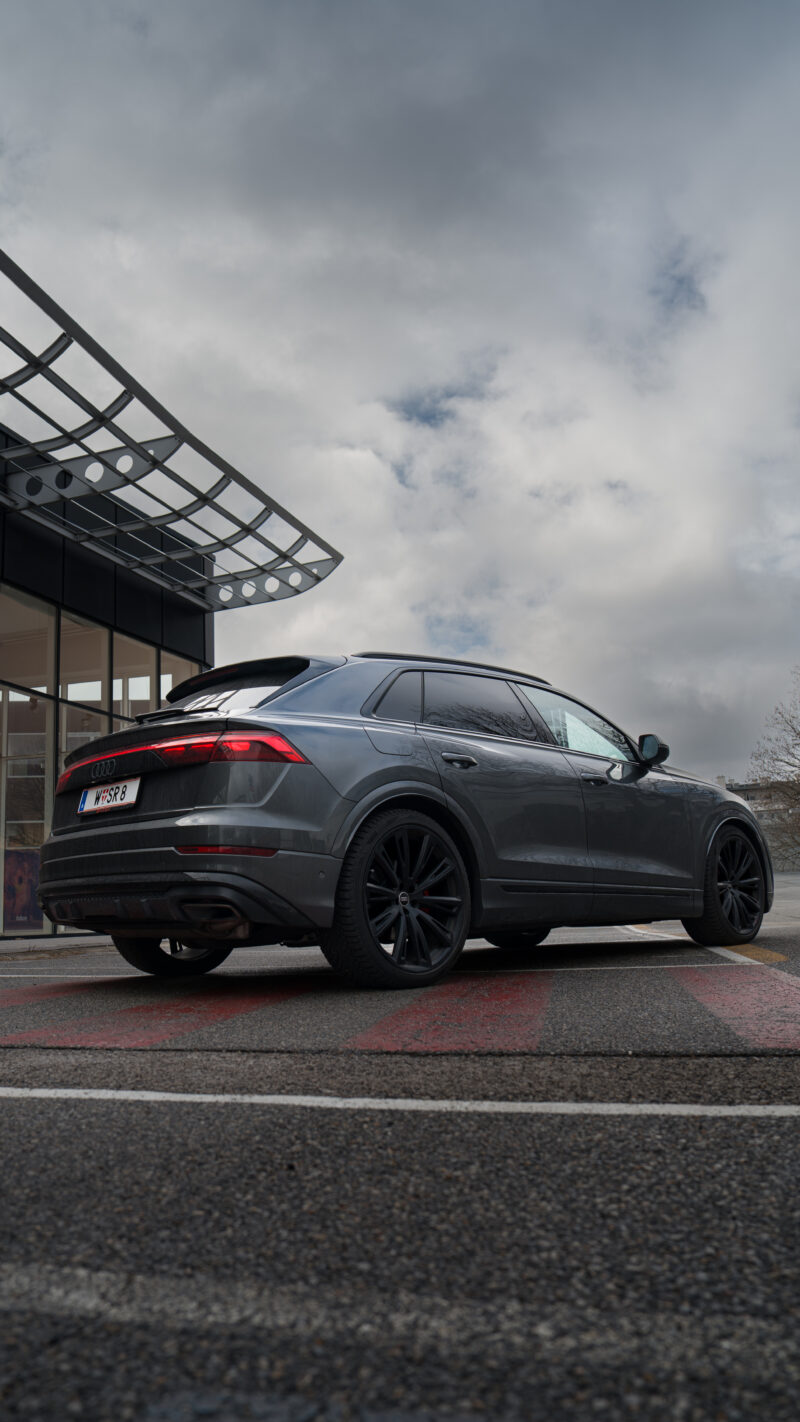 Audi Q8 rear view photographed with a dark cinematic automotive look