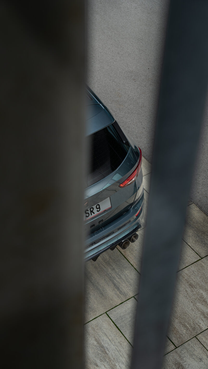 Cupra Ateca rear detail photographed through foreground elements with a cinematic style