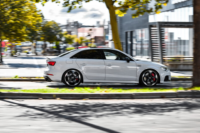 Audi RS3 rolling shot photographed with a clean side profile composition
